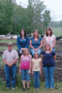 The Rausches own and operate a 60-cow, 240-acre dairy farm near Randall, Minn. While most of his children are still active on the farm, some have begun to go their separate ways. Currently, Ann works full time on the farm while Teri attends college. Crystal plans to attend college this fall. The three youngest help on the farm in between school activities. (photo by Jennifer Burggraff)