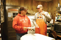 Joe Fordyce (left) of Fordyce Construction and Kevin Voorhees go over the plans for a compost barn Voorhees wants to construct this fall. (photo by Mark Klaphake)