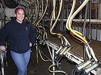 Amanda Merges works on the Kutsch farm near Sherrill, Iowa, while she attends college. She milks the goats in a swing-12 parlor.<br /><!-- 1upcrlf -->PHOTO BY KELLI BOYLEN